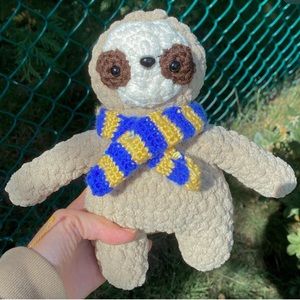 sloth with a raven claw scarf